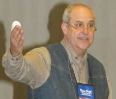 An image of Tom Urban teaching a class with his thumb bandaged.